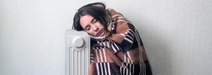 Woman leaning on radiator