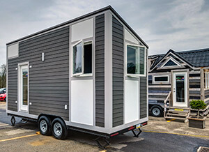modern tiny house design in a parking lot